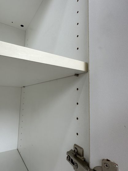 ตู้เก็บของ 2 บานเปิด โครงไม้ MDF สีขาว ขาพลาสติก ปรับระดับได้